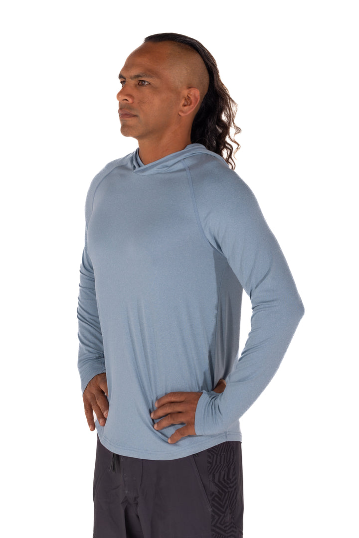 Male model wearing the Waihana Mariner Blue Hooded Long Sleeve sun shirt, shown from a three-quarter side angle against a white background.
